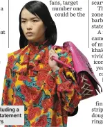  ?? Photo: Reuters ?? A JW Anderson creation including a pink barbell handbag with statement lace-up sides.