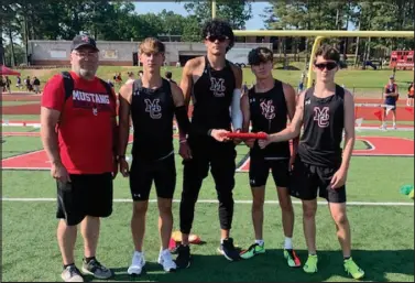  ?? Courtesy photo ?? Mustang Coach Willie Howard stands with McDonald County’s state-qualifying 4x400-meter relay squad of (from left) Dalton McClain, Josh Pacheco, Hunter Leach and Dominic Navin after the team qualified for state by finishing second with a time of 3:29.92 at the Sectional Meet held Saturday, May 20, at West Plains.