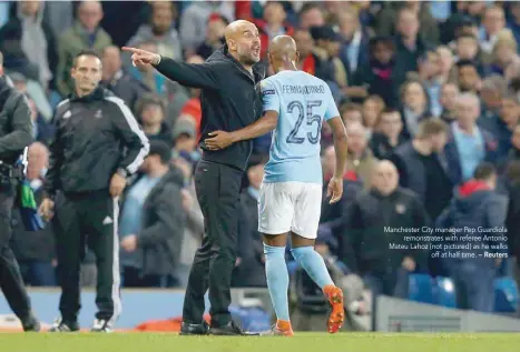  ??  ?? Manchester City manager Pep Guardiola remonstrat­es with referee Antonio Mateu Lahoz (not pictured) as he walks off at half time. — Reuters