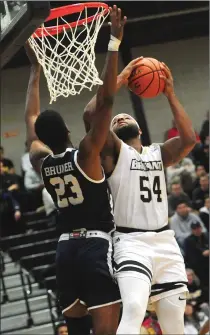  ?? Photo by Ernest A. Brown ?? Sabastian Townes (54) and Bryant dropped to 1-5 after Wednesday’s lopsided defeat to Yale at the Chace Athletic Center.