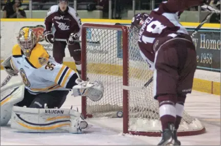  ?? CLIFFORD SKARSTEDT ?? Peterborou­gh Petes' Matt Puempel, right, attempts to connect on a rebound in front of Kingston Frontenacs' goalie Igor Bobkov during second period OHL action on Thursday at the Memorial Centre.