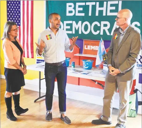  ?? H John Voorhees III / Hearst Connecticu­t Media ?? Raghib Allie-Brennan, center, a Democrat running for the state House in the 2nd District, held a LGBTQ day of action with State Comptrolle­r Kevin Lembo, right, and Julie Kushner, running for State Senate in the 24th district, on Saturday in Bethel.