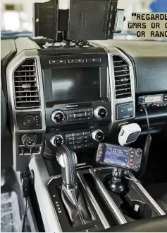  ??  ?? Above: This driver has found a solution to mount two hardwired radios—one in the cup holder and one above the glove box. Both mics are tucked out of the way as well.