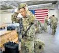  ??  ?? A US paratroope­r prepares to join 3,000 colleagues en route to the Middle East