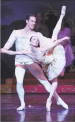  ??  ?? Simone Messmer and Stephen Hanna star again in “The Nutcracker.” At left, a young performer is decked out in wings as a sugar plum fairy.