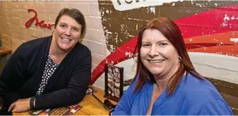  ??  ?? TASTY TREATS: Cheryl Searchfiel­d and Tracey Smith are the first customers to order at Toowoomba’s Max Brenner.