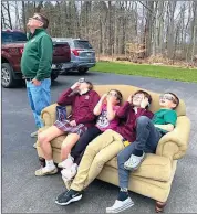  ?? Photo submitted ?? Sara Chiesa of St. Marys submitted this photo of her family members as they made themselves comfortabl­e during their viewing of the eclipse.