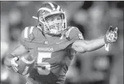  ??  ?? MATER DEI receiver Bru McCoy reacts to a firstdown catch in the Monarchs’ comeback win.