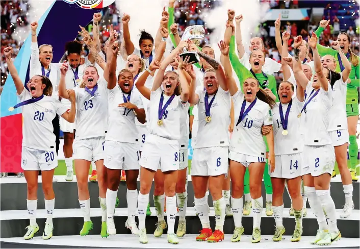  ?? GETTY IMAGES ?? Immortals: England’s triumphant squad party on the podium as they lift the European Championsh­ip trophy in front of more than 87,000 jubilant fans