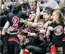  ?? STEVE BOSCH/ PNG ?? John Barsby Bulldogs players and fans celebrate their victory Saturday over Mission Roadrunner­s. The Nanaimo school won the final 36- 20.