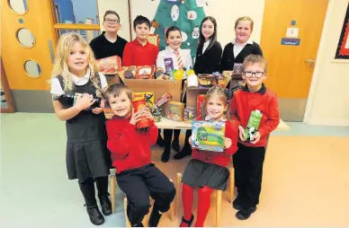  ??  ?? Christmas spirit The children took part in an Advent caendar with a difference for the Foodbank