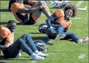  ?? Aaron Ontiveroz / The Denver Post ?? The Broncos’ Phillip Lindsay, right, jokes with Jeremy Cox during practice Thursday at Uchealth Training Center in Englewood.