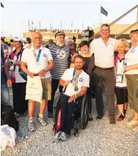  ?? (Courtesy) ?? KONSTANTIN AFINOGENOV (center) shows his Maccabiah medals with fellow team members, Maccabi World Union Executive Director Eyal Tiberger and GPF Deputy CEO Sana Britavsky.