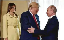  ?? Alexei Nikolsky / Sputnik, Kremlin pool via Associated Press ?? Russian President Vladimir Putin welcomes President Donald Trump and first lady Melania Trump on Monday in Finland.
