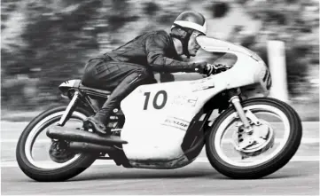  ??  ?? BELOW: On the way to glory in the 1969 Belgian GP at Spa on a 500cc Triumph – he finished second to Agostini