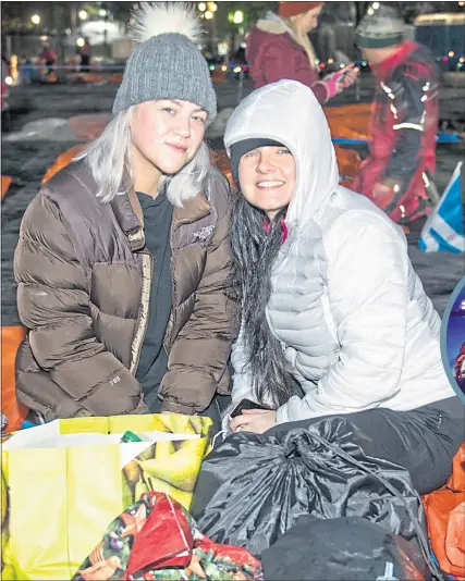  ??  ?? Courtney Tennent and Kate Abernethy, from Erskine, join the sleep out in Glasgow’s Kelvingrov­e last night