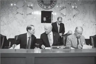  ?? ERIC THAYER / THE NEW YORK TIMES ?? From left: Sens. Ron Wyden, D-ore., Orrin Hatch, R-utah, and Chuck Grassley, R-iowa, attend a Senate Finance Committee meeting in November on Capitol Hill. Despite no support from Democrats for the GOP plan, there never was, in the minds of Republican...