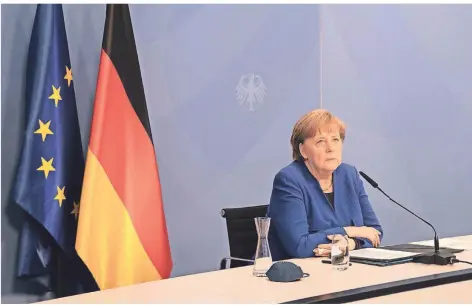  ?? FOTO: FILIP SINGER/DPA ?? Bundeskanz­lerin Merkel forderte in der digitalen Konferenz internatio­nale Solidaritä­t und warb für das Mittel der CO2-Bepreisung.