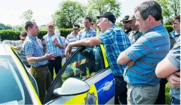  ?? O’GORMAN PHOTOGRAPH­Y ?? Garda Tom Brosnan, PSV Inpector, Bandon addresses farmers on new standards and road rules for agricultur­al vehicles at the Dairygold/Teagasc Dairy Developmen­t Programme Health and Safety Event on Dan O’Donovan’s farm at Coolmakee, Farnanes, Co Cork.