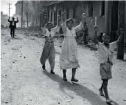  ??  ?? Korean war was the single greatest calamity of the period. Residents of Inchon surrender to American troops in 1950.