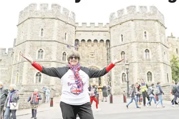  ??  ?? Royal superfan Werner poses outside Windsor Castle ahead of Prince Harry and Meghan Markle’s wedding, in Windsor, on Wednesday. — Reuters photo