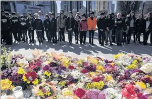  ?? CP FILE PHOTO ?? Flowers line a memorial at Mel Lastman Square in Toronto on April 26 for the victims of a deadly van attack.