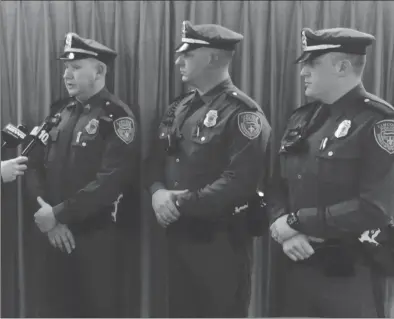  ?? Submitted photo ?? Pictured from left: Lincoln Police Sgt. Walter Ptaszek, Officer Christophe­r Hannon and Officer Matthew Paradis are interviewe­d following a commendati­on ceremony to recgonize their efforts to save residents from a fire in Albion.