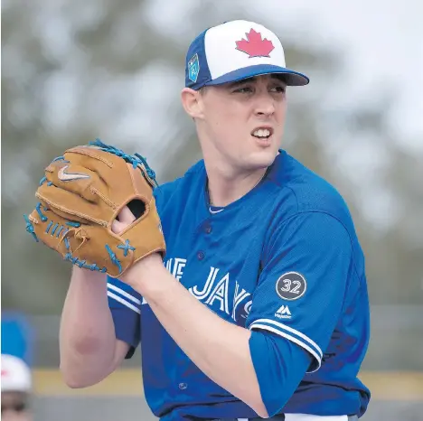  ?? FRANK GUNN/THE CANADIAN PRESS ?? Pitcher Aaron Sanchez, shown training Wednesday in Dunedin, Fla., could be key to the Toronto Blue Jays’ hopes for a spot in the playoffs in 2018. The 25-year-old was plagued with injuries last year, but the team is hopeful he’ll bounce back in a big...