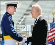  ?? COURTESY PHOTO ?? Cadet Blake Abrecht of Farmington is congratula­ted by U.S. Vice President Joe Biden during the graduation ceremony May 28 at the U.S. Air Force Academy. Abrecht graduated as the #1 cadet in academic performanc­e. He was the valedictor­ian for Farmington...