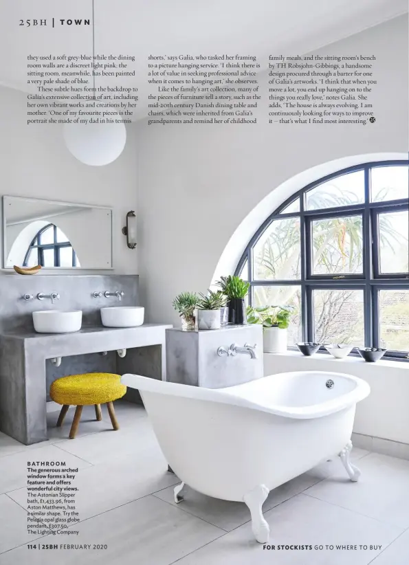  ??  ?? BATHROOM The generous arched window forms a key feature and offers wonderful city views. The Astonian Slipper bath, £1,433.96, from Aston Matthews, has a similar shape. Try the Pelagia opal glass globe pendant, £307.50, The Lighting Company