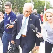  ?? Lisa Backus / For Hearst Connecticu­t Media ?? Gloria Farber’s attorney, Richard Weinstein, leaves Hartford Superior Court following a hearing in the civil lawsuits filed against Fotis Dulos.