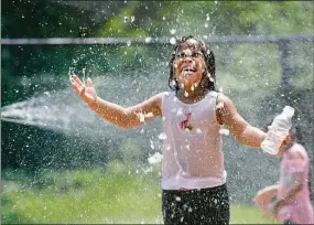  ?? Carol Kaliff / Hearst Connecticu­t Media file photo ?? Elia Backus, 5, cools off Aug. 7, 2018, at the Highland Avenue Spray Park in Danbury.