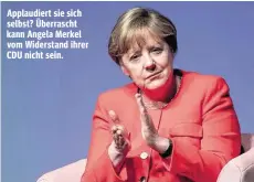  ??  ?? Applaudier­t sie sich selbst? Überrascht kann Angela Merkel vom Widerstand ihrer CDU nicht sein.