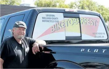  ?? LAURA BARTON/WELLAND TRIBUNE ?? Bruce Bissell stands beside his pickup truck, which has informatio­n about his motorcycle event Biketoberf­est emblazoned on the back window. The event is an opportunit­y for motorcycli­sts to come together one last time before putting the bikes away for the season and takes place this Friday and Saturday at the Welland County Motorcycle Club.