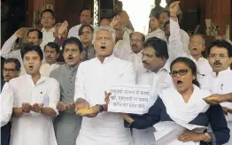  ?? — PRITAM BANDYOPADH­YAY ?? Congress MPs stage a protest against the hike in MSP of kharif crops in Parliament House on Thursday.
