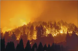  ?? NOAH BERGER — THE ASSOCIATED PRESS FILE ?? The Glass Fire burns a hillside above Silverado Trail in St. Helena on Sept. 27.