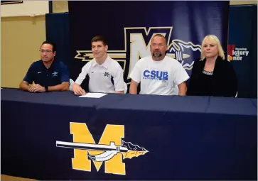  ?? CONTRIBUTE­D PHOTO ?? Monache High School’s Mark Cardwell Jr. (second from left) waits to sign a National Letter of Intent to wrestle at California State University, Bakersfiel­d, Monday, Nov. 19, at Monache High School.