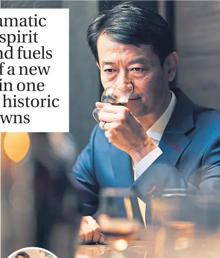  ?? ?? Koji Shimaoka, founder of the new Komoro distillery, samples a whisky at Bar Queen’s-q in Tokyo