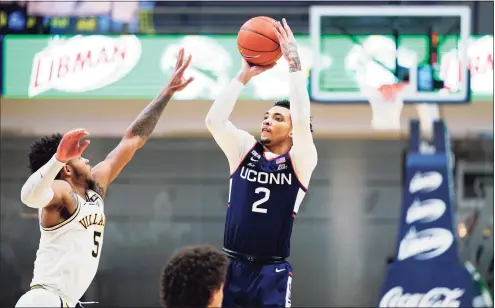  ?? Matt Slocum / Associated Press ?? UConn’s James Bouknight (2) goes up for a shot against Villanova’s Justin Moore during the second half on Saturday.