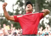  ?? David J. Phillip/
AP file photo ?? ■ Tiger Woods reacts as he wins the Masters golf
tournament on April 14 2019, at Augusta National in Augusta, Ga. It was voted the third best Masters.