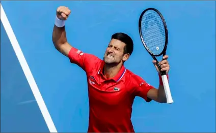  ?? AP Photo/Hamish Blair ?? Serbia’s Novak Djokovic celebrates after defeating Canada’s Denis Shapovalov in their ATP Cup match in Melbourne, Australia, on Tuesday.