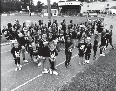  ??  ?? Cheering: Girls from Smackover and Norphlet Elementary wait to perform as Future Buckaroo Cheerleade­rs at a recent Buckaroo pregame.