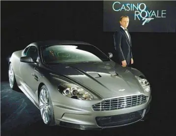  ?? MARTIN/THE NEW YORK TIMES ?? James Bond, played by Daniel Craig, drives an Aston Martin DBS in “Casino Royale.”ASTON