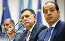  ?? MOHAMED BEN KHALIFA / ASSOCIATED PRESS 2016 ?? Fayez Serraj, head of the U.N.-backed unity government, meets with his team in Tripoli, Libya. The GNA controls the western portion of the war-torn country.