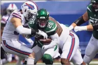  ?? Brett Carlsen / Associated Press ?? Jets running back Le’Veon Bell runs with the ball as the Bills’ Trent Murphy (93) makes a tackle Sept. 13.