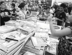  ??  ?? BACK TO SCHOOL – Parents and their children do last-minute shopping for school supplies in Gaisano Mall in Davao City. School children will troop back to their schools today, June 1, the opening of classes in public elementary and high schools all over...