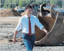  ?? ADRIAN WYLD
THE CANADIAN PRESS ?? At a ground-breaking ceremony for an Amazon distributi­on cente in Ottawa, Prime Minister Justin Trudeau warned that the politics of division are creating a “dangerous path” for Canada.