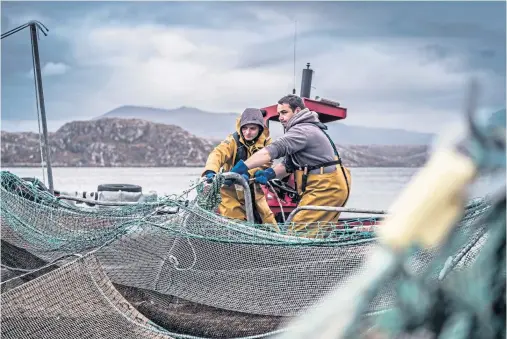  ??  ?? HAUL: Salmon farming is a key Scottish industry, and a collaborat­ive research project hopes to find answers to the issue of gill disease
