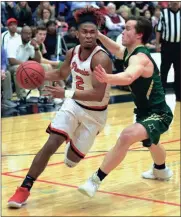  ?? LARRY GREESON / For the Calhoun Times ?? Sonoravill­e’s Trent Daniel (2) drives around Adairsvill­e’s Jessie O’Kelley during Tuesday’s game.