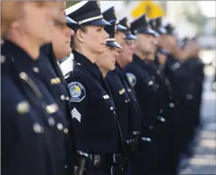  ?? PAUL BERSEBACH — STAFF PHOTOGRAPH­ER ?? Officers wait to be inspected by Santa Ana Chief of Police David Valentin and his commanders in 2018.